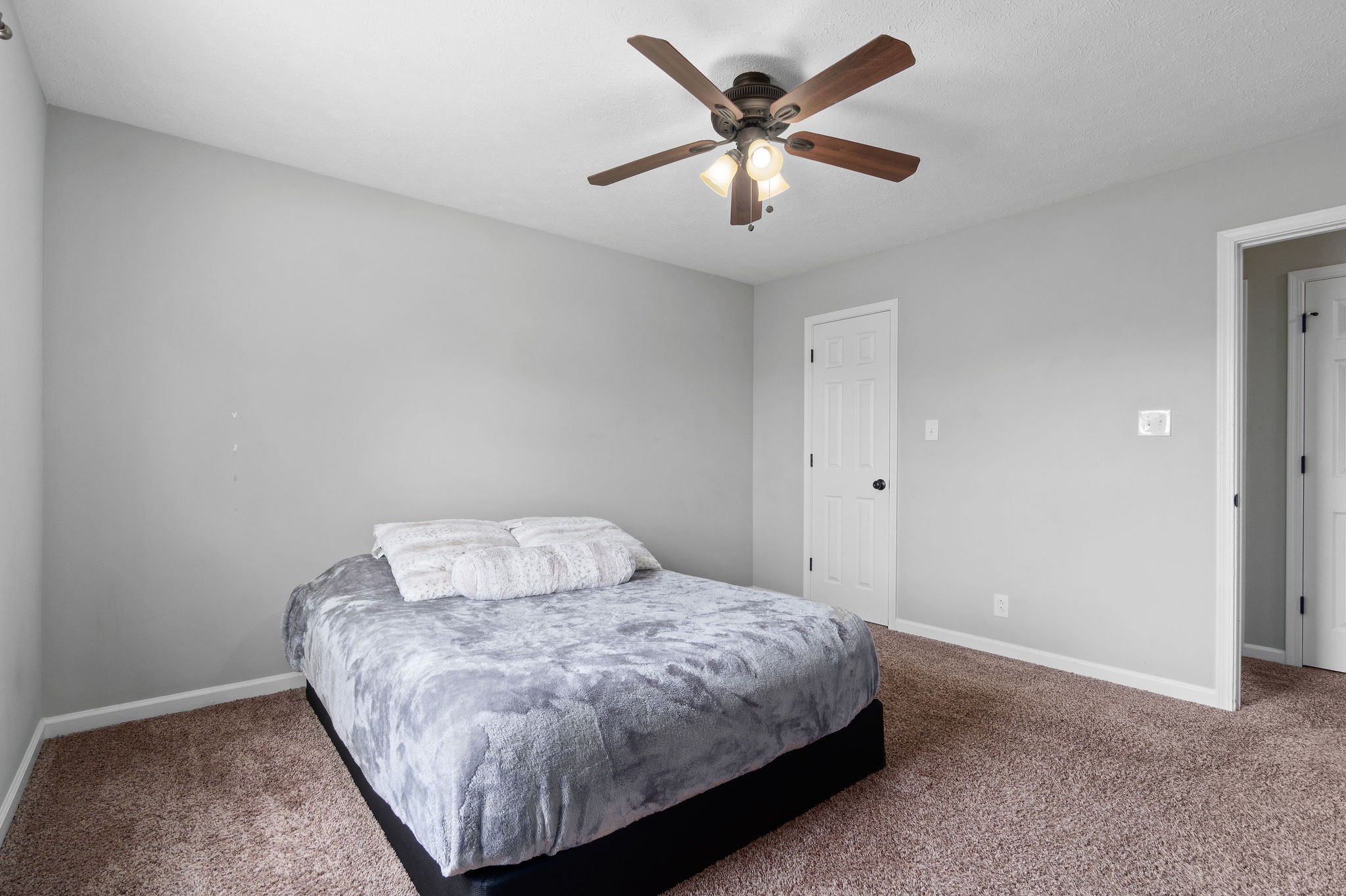 963 State Line Road Oak Grove, KY 42262 - Photo 25 of 33 a bedroom with a bed and a ceiling fan