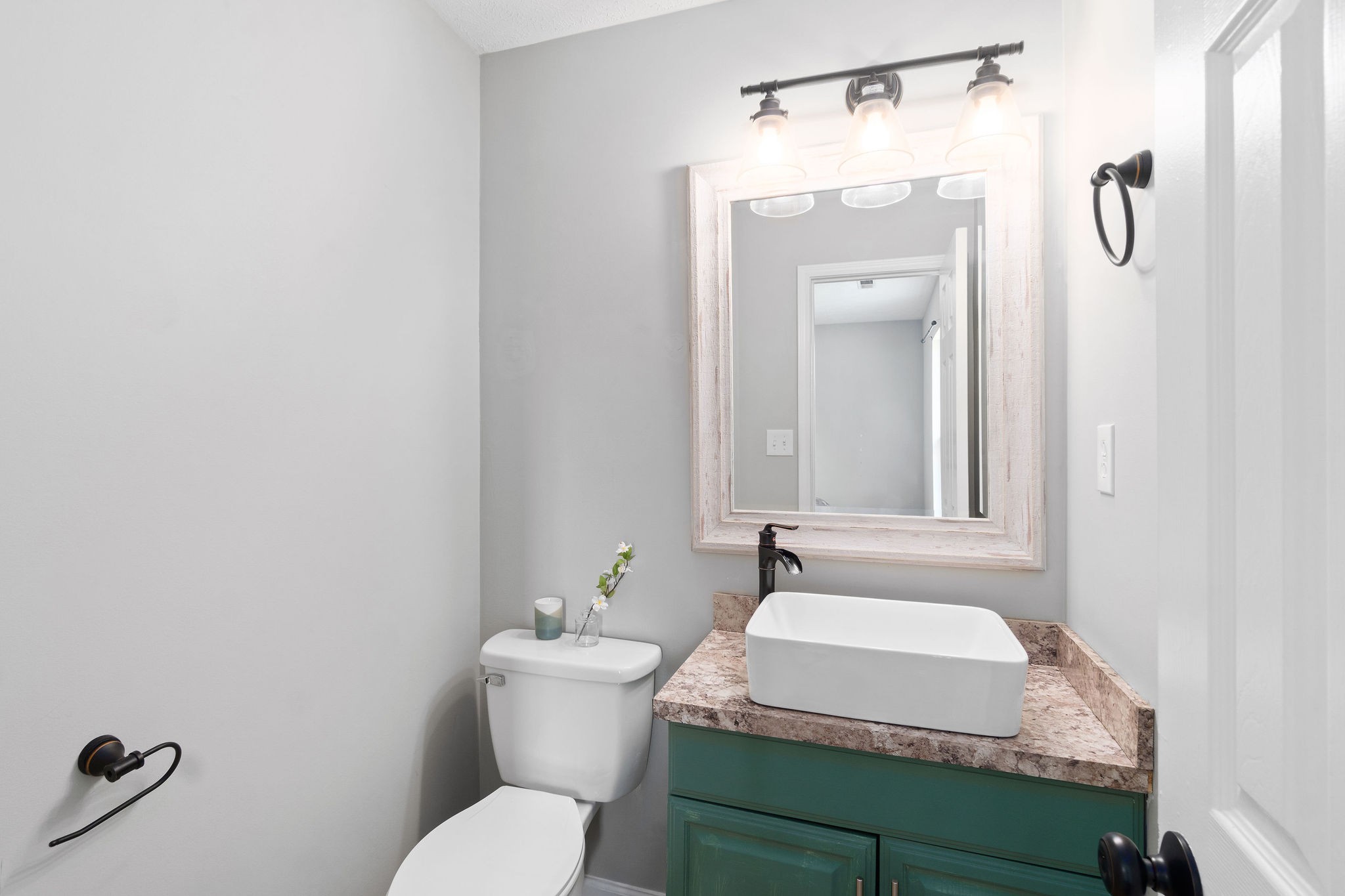 963 State Line Road Oak Grove, KY 42262 - Photo 26 of 33 a bathroom with a granite countertop sink and a mirror with toilet