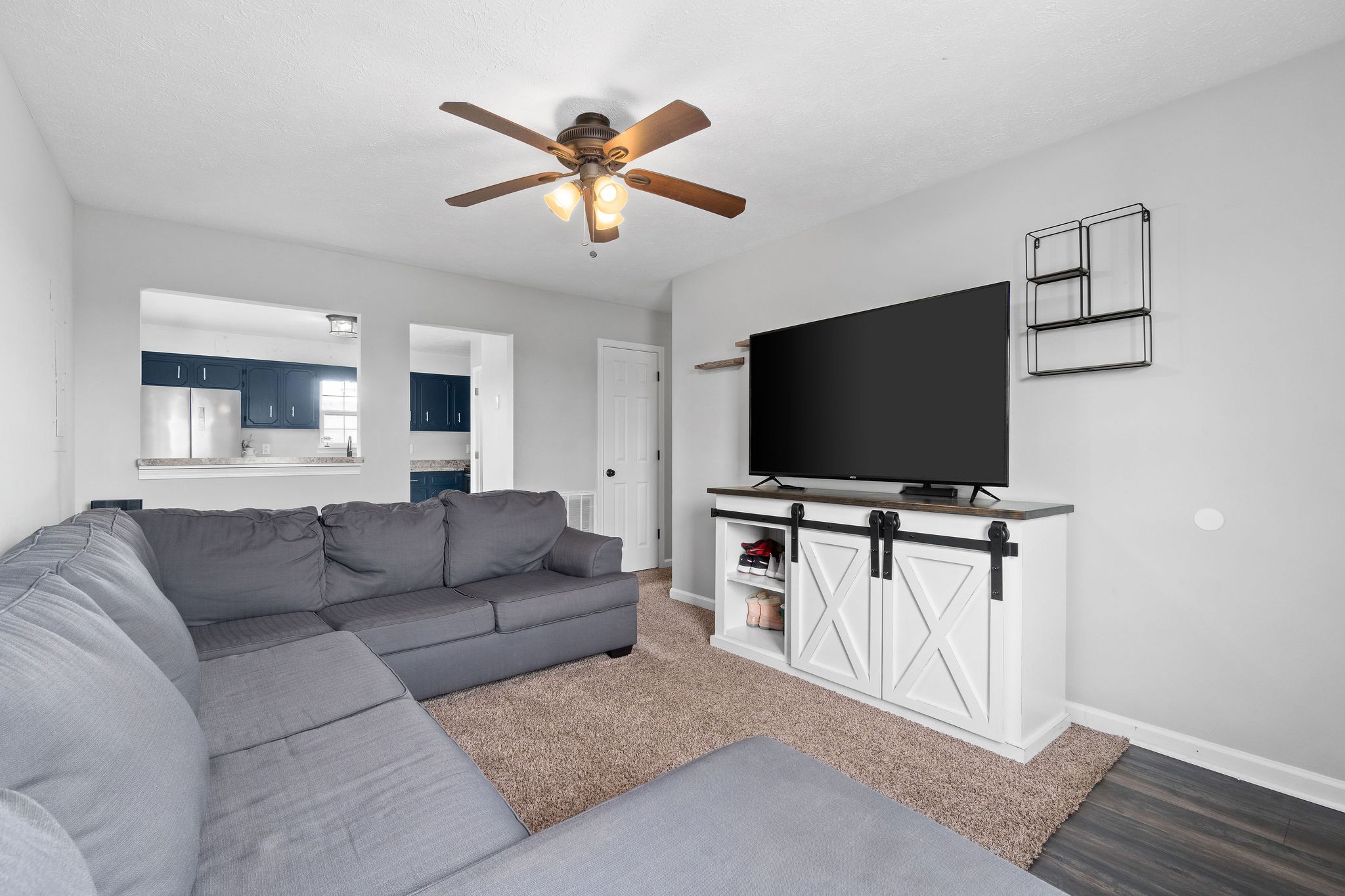 963 State Line Road Oak Grove, KY 42262 - Photo 10 of 33 a living room with furniture and a flat screen tv