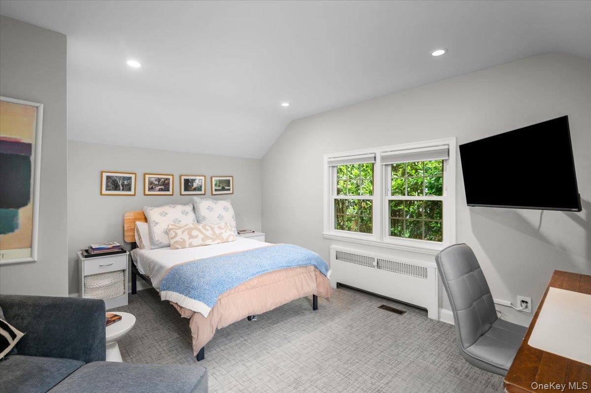 49 Eton Road Larchmont, NY 10538 - Photo 16 of 34 a bedroom with a bed and a flat screen tv
