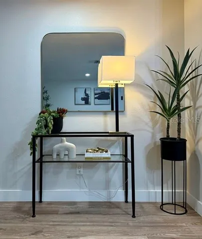 a view of living room with furniture and wooden floor