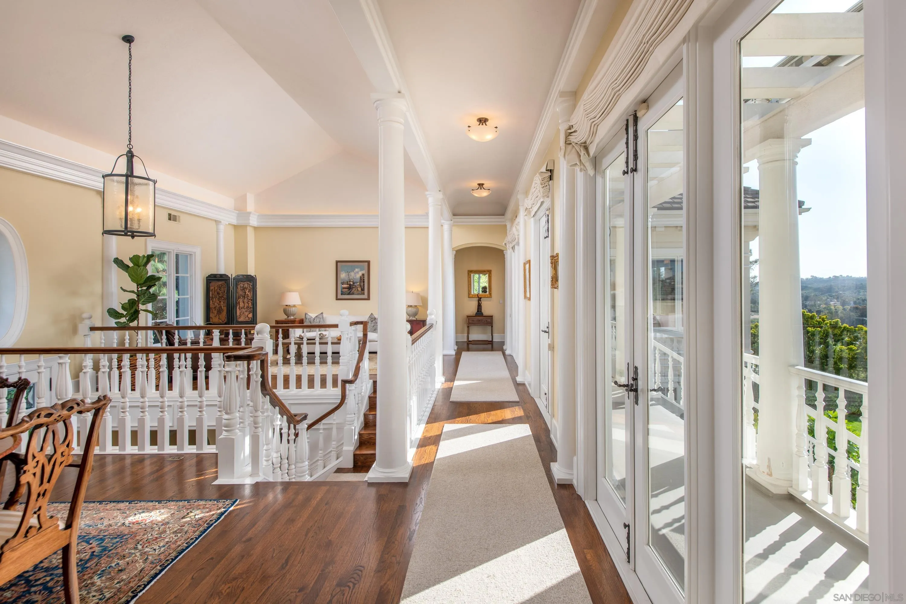 3023 Paseo Cielo Rancho Santa Fe, CA 92067 - Photo 12 of 33 a view of a hallway with wooden floor