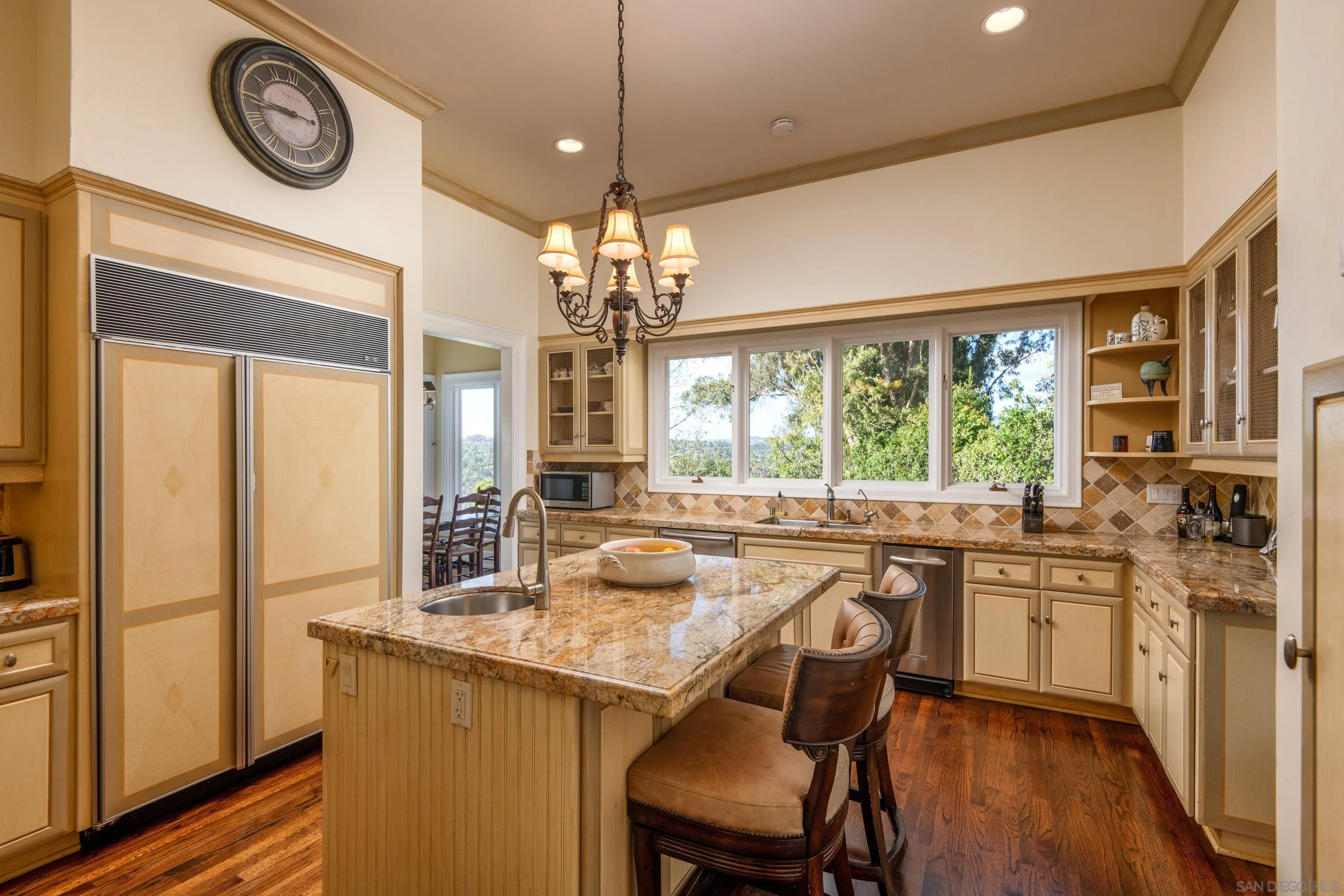 3023 Paseo Cielo Rancho Santa Fe, CA 92067 - Photo 19 of 33 a kitchen with a large window and cabinets