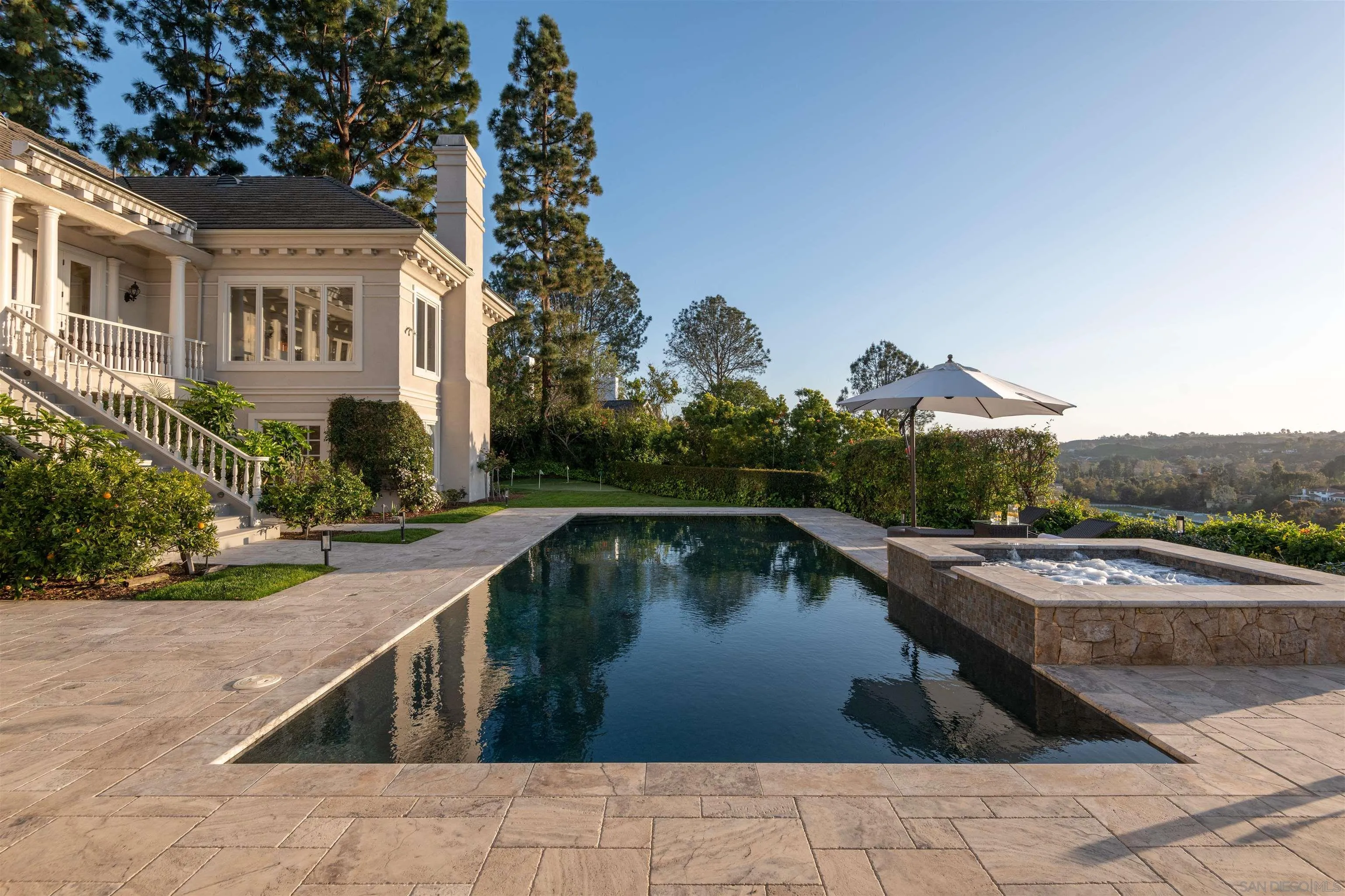 3023 Paseo Cielo Rancho Santa Fe, CA 92067 - Photo 2 of 33 a view of swimming pool with outdoor seating and plants