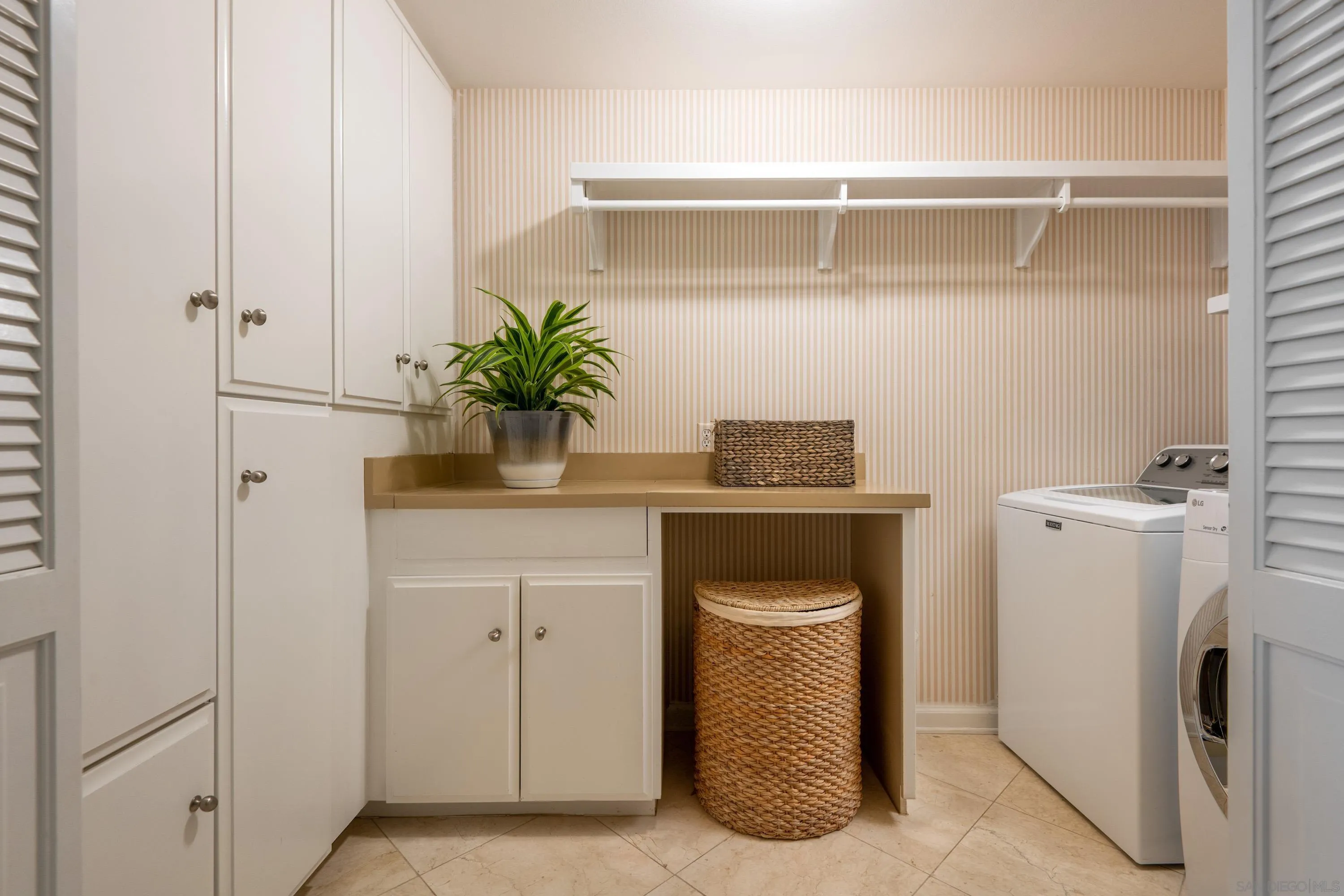 3023 Paseo Cielo Rancho Santa Fe, CA 92067 - Photo 30 of 33 a kitchen with a refrigerator and cabinets