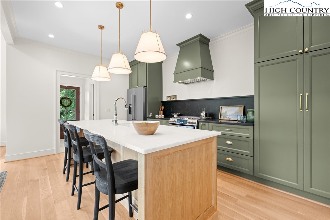 2181 Broadstone Road Banner Elk, NC 28604 - Photo 13 of 38 a kitchen with a table chairs and a sink