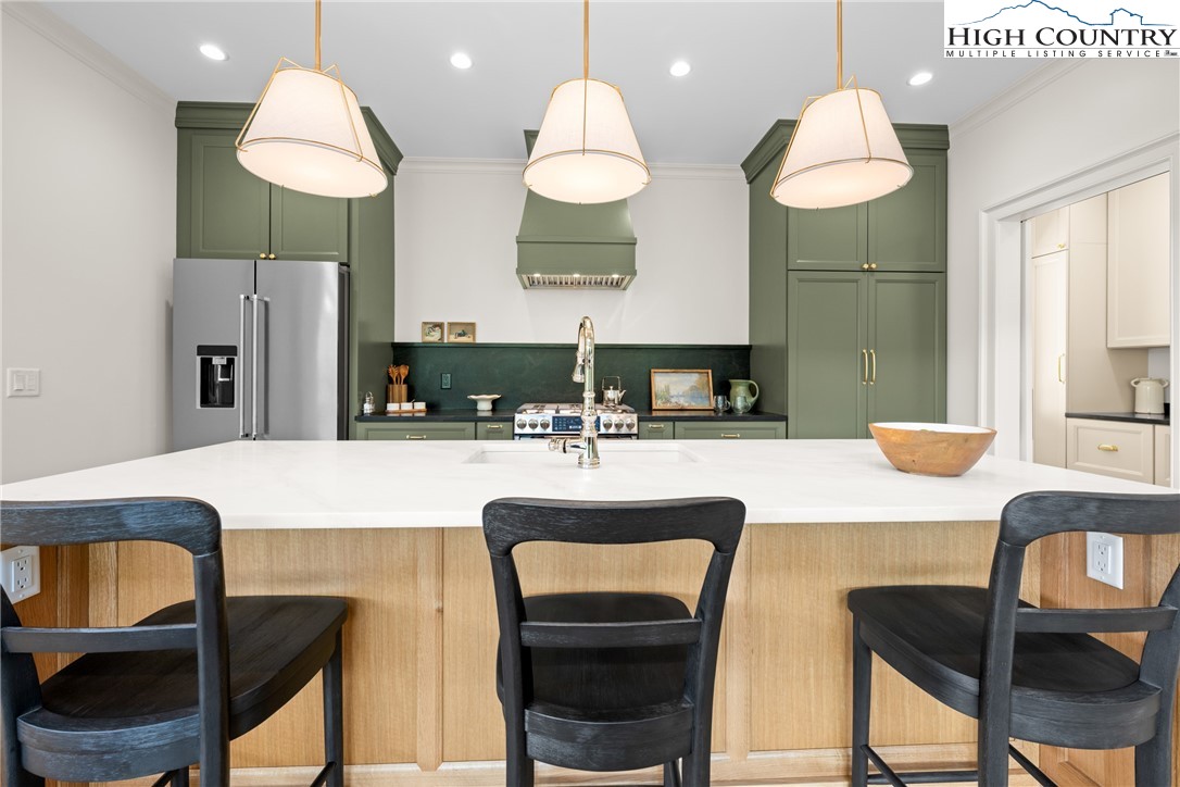 2181 Broadstone Road Banner Elk, NC 28604 - Photo 18 of 38 a kitchen with a table and chairs