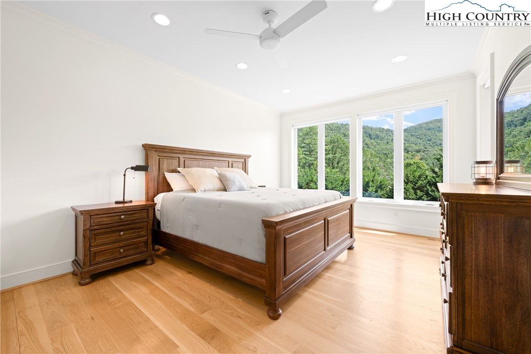 2181 Broadstone Road Banner Elk, NC 28604 - Photo 20 of 38 a view of bedroom with furniture and large windows