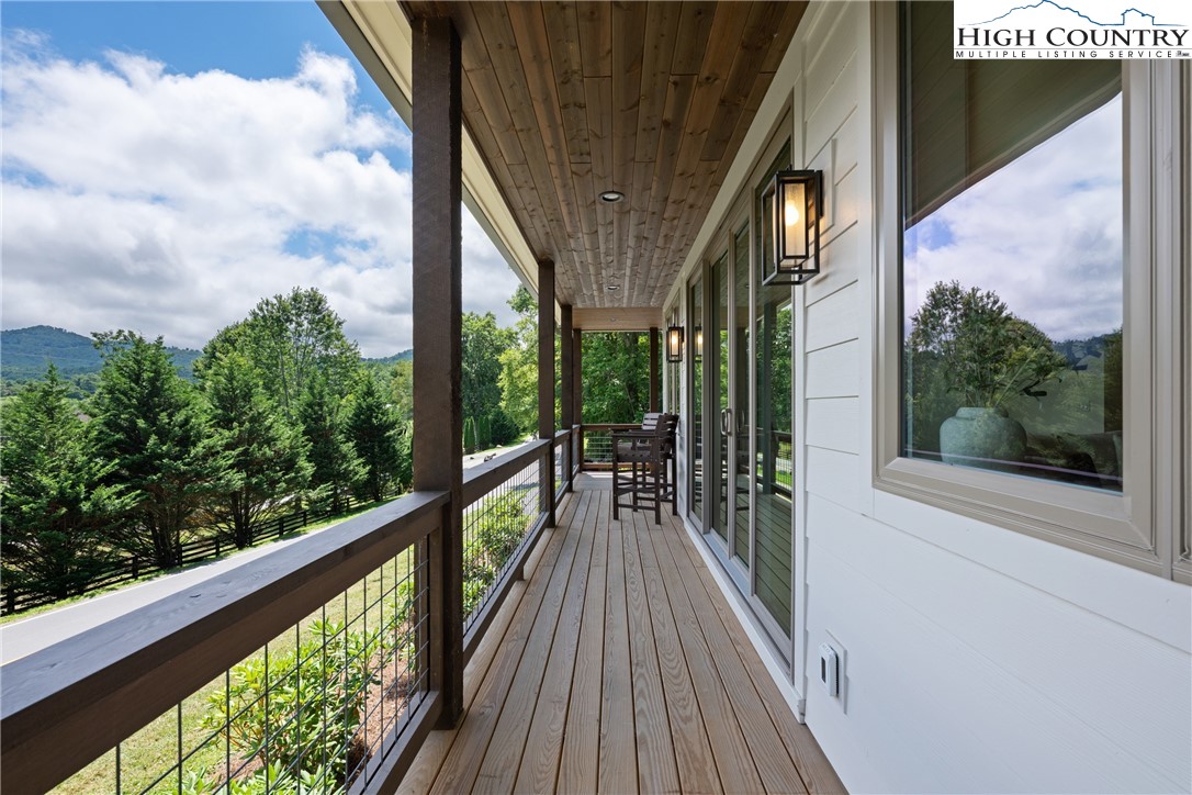 2181 Broadstone Road Banner Elk, NC 28604 - Photo 32 of 38 a view of a balcony with wooden floor