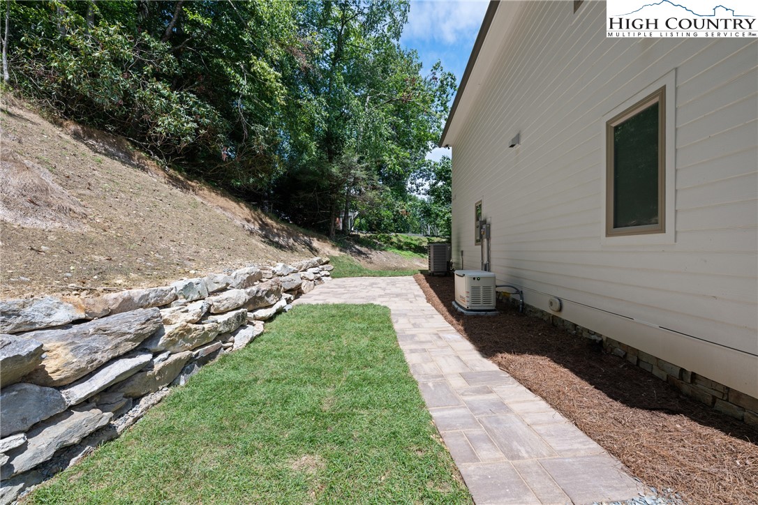 2181 Broadstone Road Banner Elk, NC 28604 - Photo 33 of 38 a view of a backyard with pathway