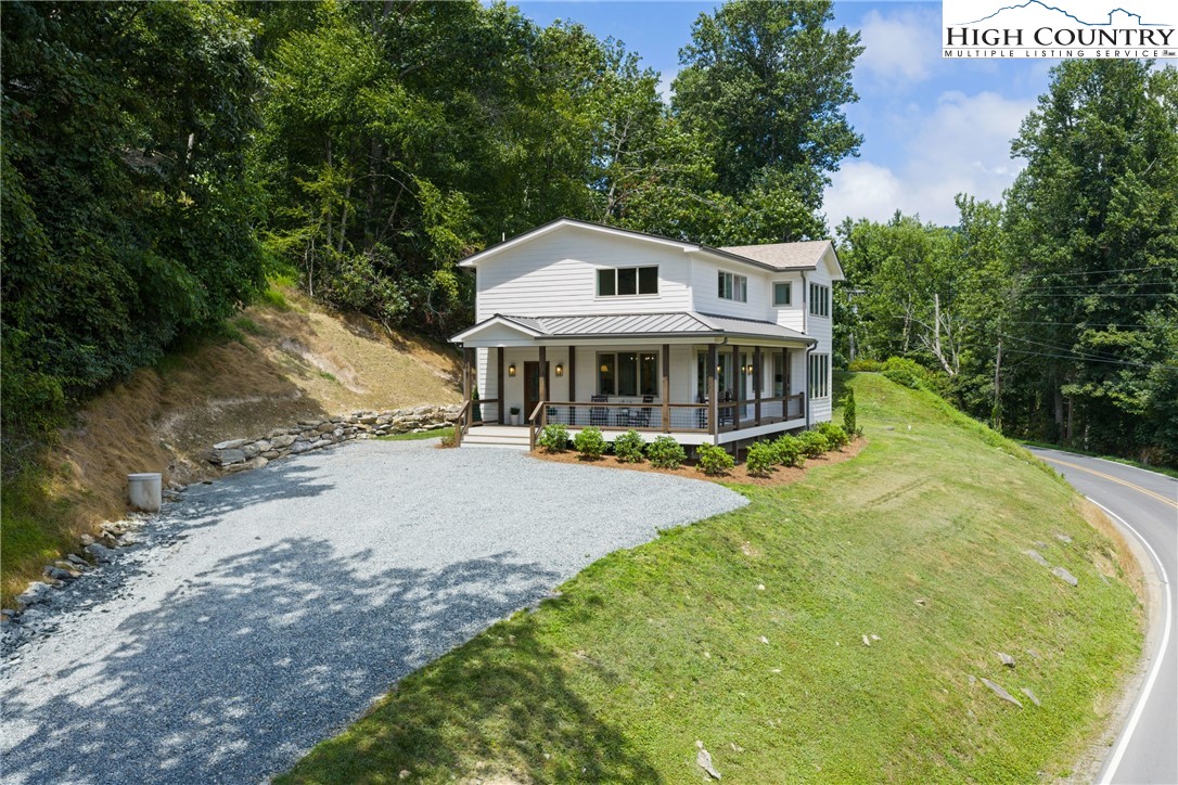 2181 Broadstone Road Banner Elk, NC 28604 - Photo 37 of 38 a view of a house with pool and sitting area