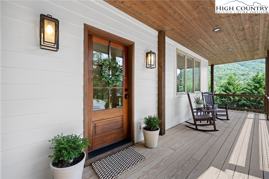 2181 Broadstone Road Banner Elk, NC 28604 - Photo 7 of 38 a view of a chair and table in the balcony
