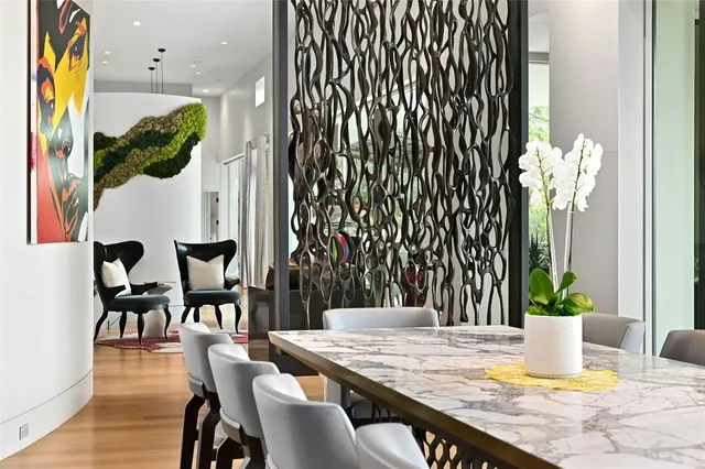 a dining room with furniture and wooden floor