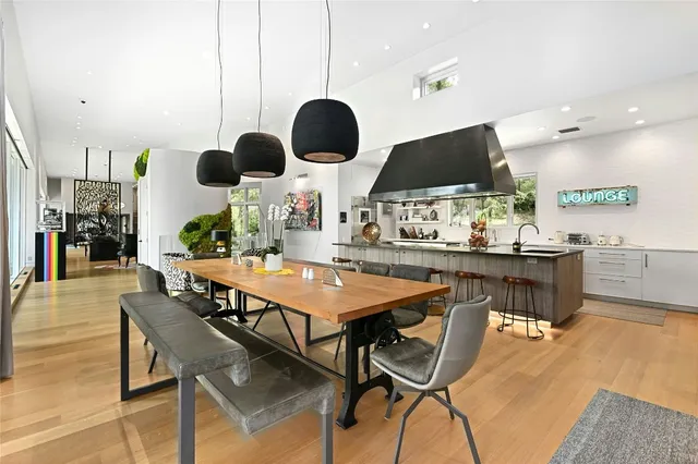 a kitchen with a table and chairs in it