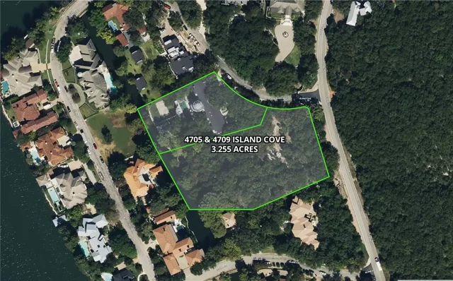 an aerial view of a residential houses with outdoor space