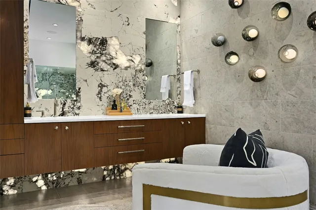 a bathroom with a sink a mirror and shower