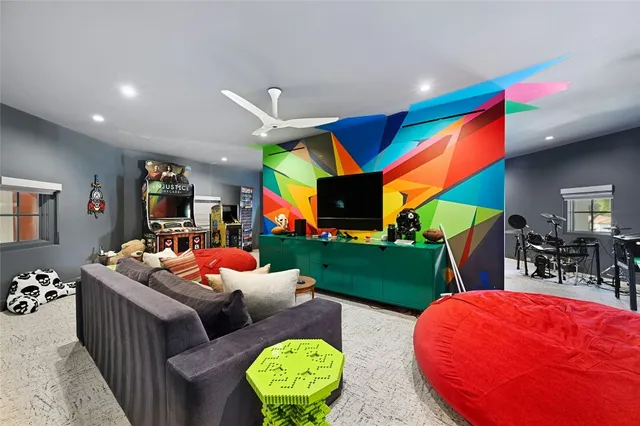 a living room with furniture a rug and a fireplace