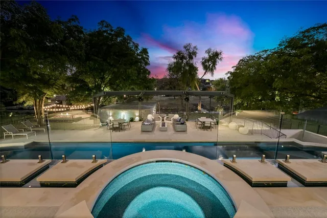 a terrace with outdoor seating and city view