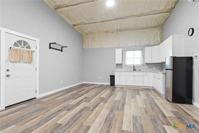 a view of a kitchen with electric appliances