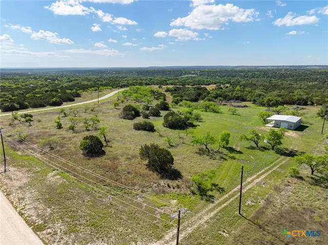 an aerial view of residential house with outdoor space