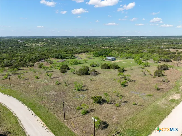 a view of a garden with a house