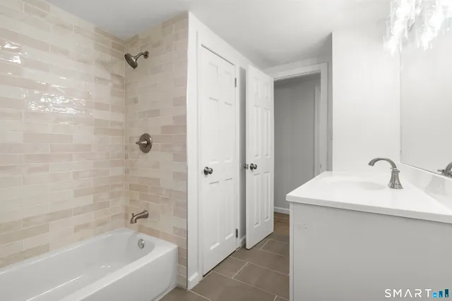 a bathroom with a bathtub and a sink