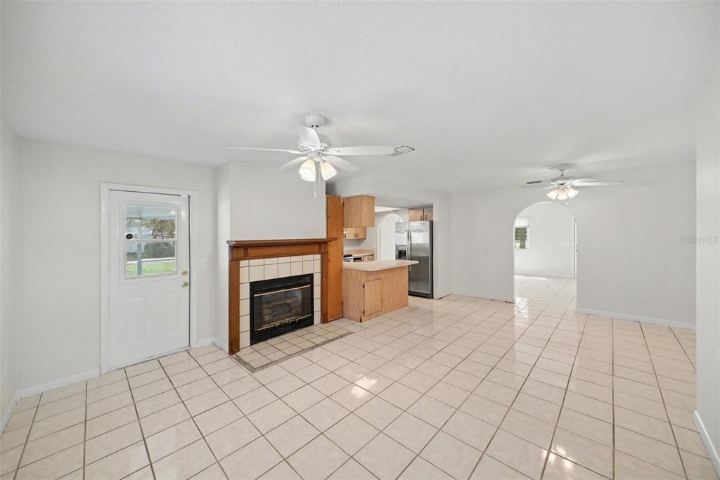 113 Ruskin Avenue Spring Hill, FL 34606 - Photo 12 of 32 a view of a livingroom with an empty space and a fireplace