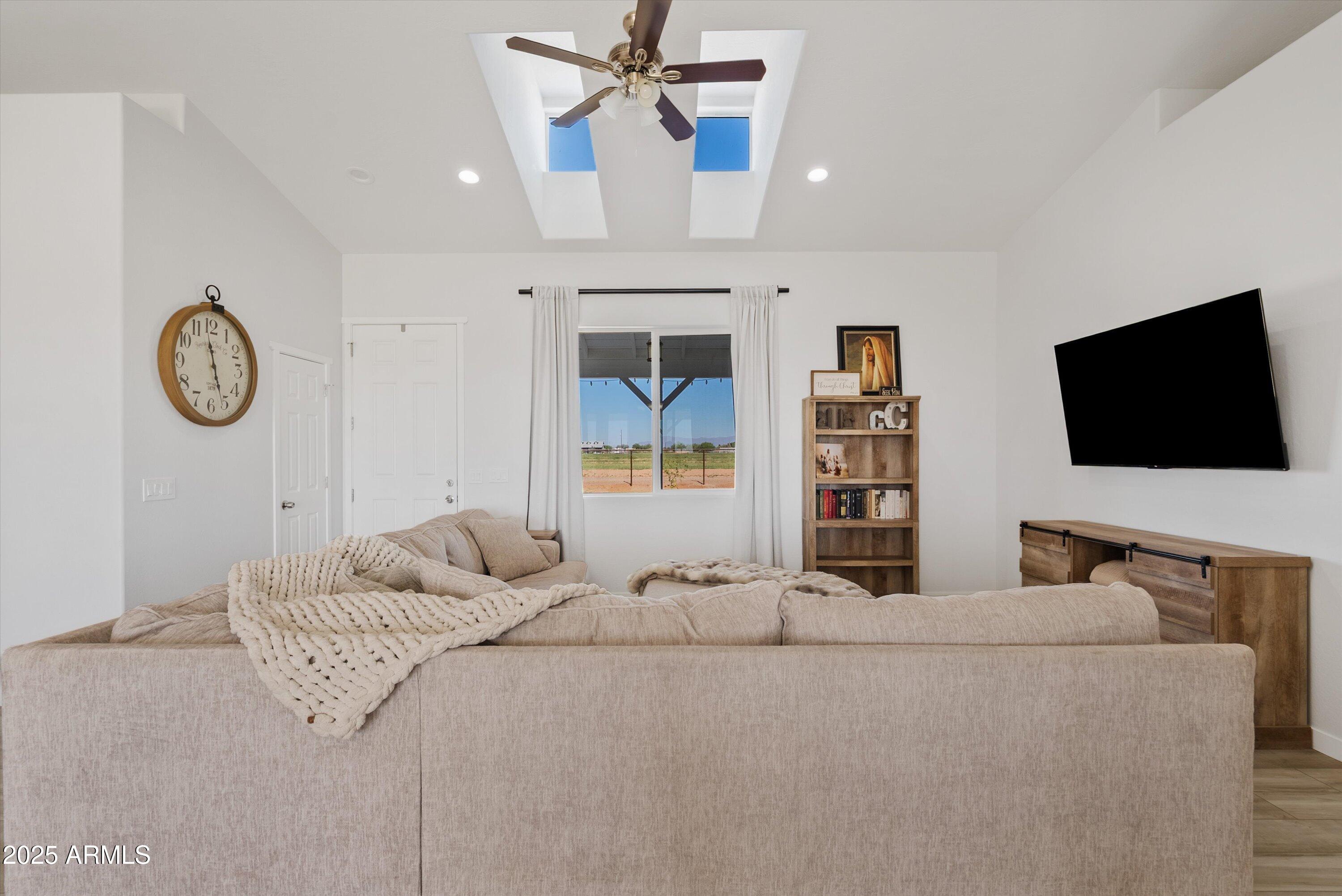 10473 East Dixie Road Florence, AZ 85132 - Photo 9 of 42 a bedroom with a bed and a flat screen tv