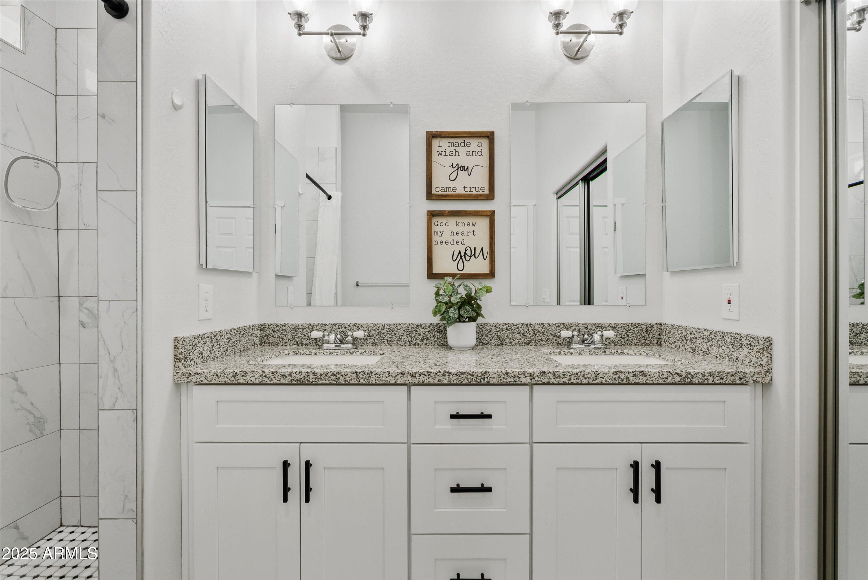 10473 East Dixie Road Florence, AZ 85132 - Photo 21 of 42 a bathroom with a granite countertop sink and a mirror