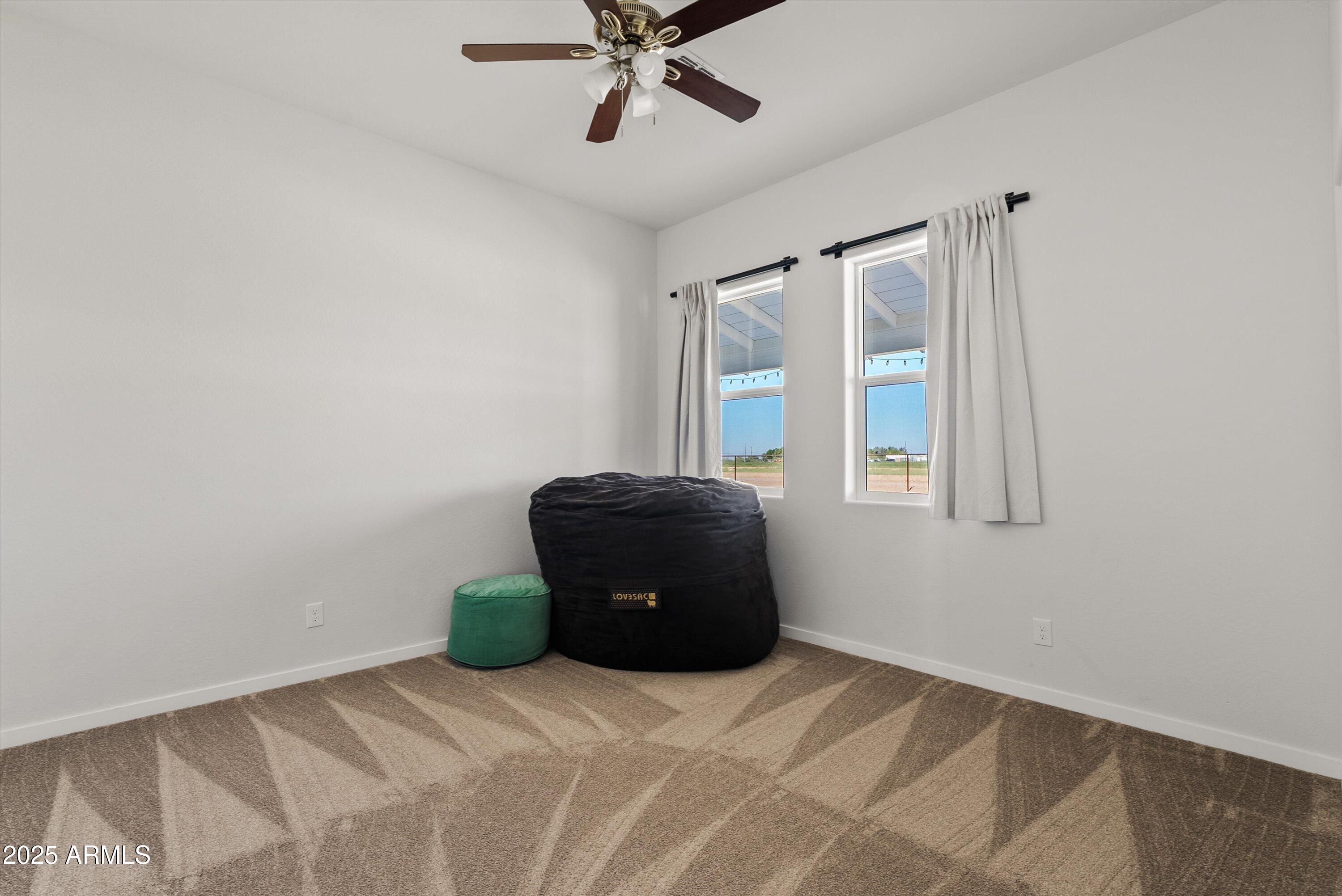 10473 East Dixie Road Florence, AZ 85132 - Photo 23 of 42 a bedroom with a bed and window
