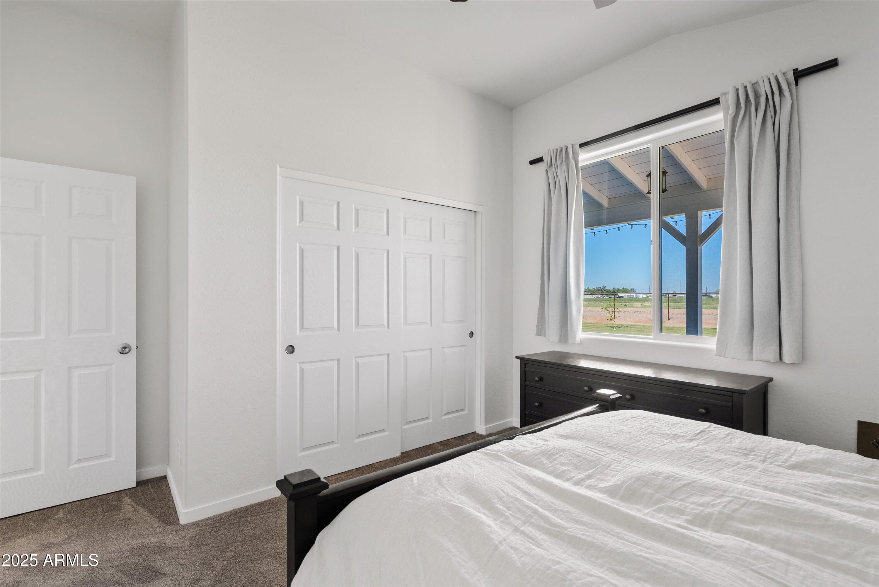 10473 East Dixie Road Florence, AZ 85132 - Photo 26 of 42 a bedroom with a bed and a window