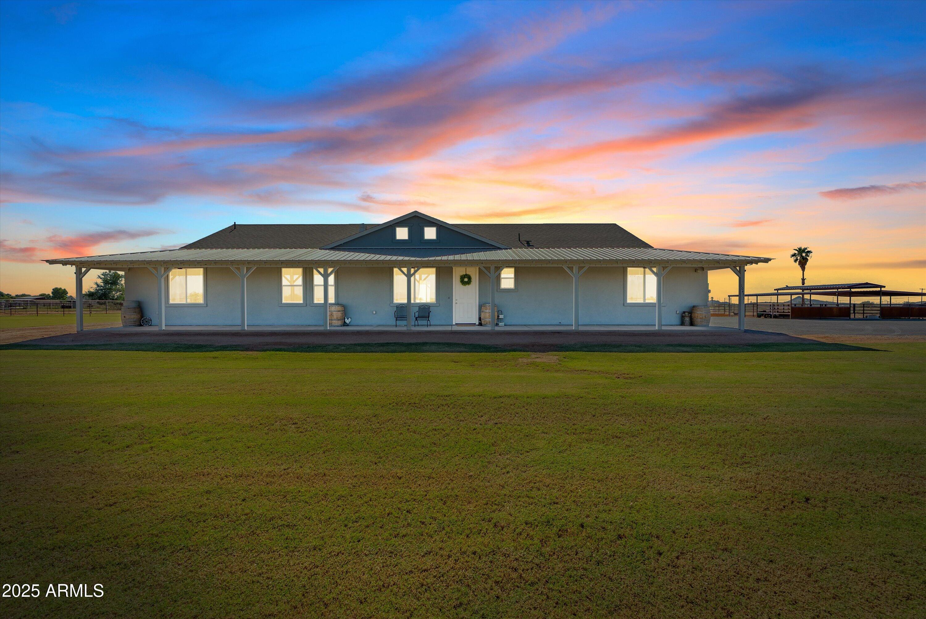 10473 East Dixie Road Florence, AZ 85132 - Photo 3 of 42 a front view of a house with swimming pool