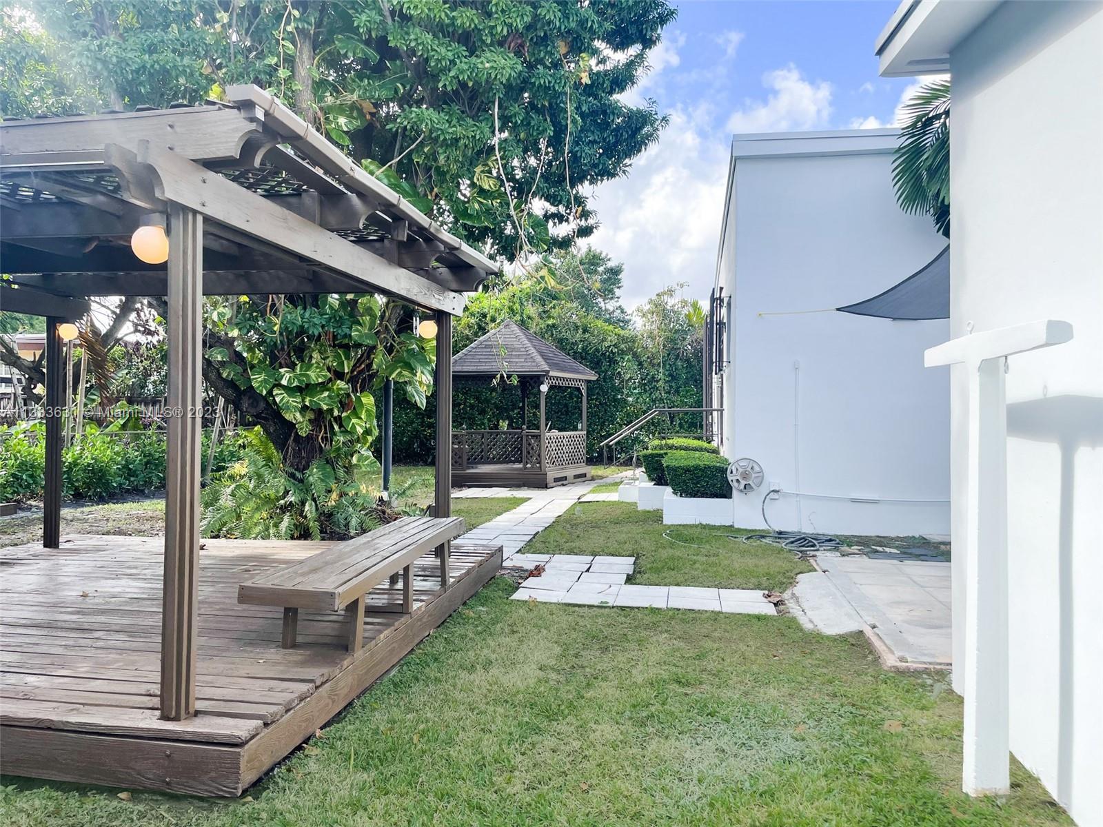 8600 Southwest 33rd Terrace Miami, FL 33155 - Photo 13 of 14 a view of a house with backyard and sitting area