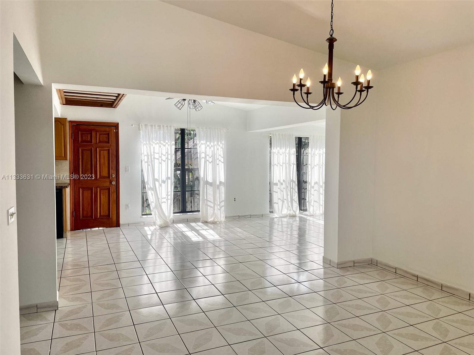 8600 Southwest 33rd Terrace Miami, FL 33155 - Photo 2 of 14 a view of a hallway with chandelier