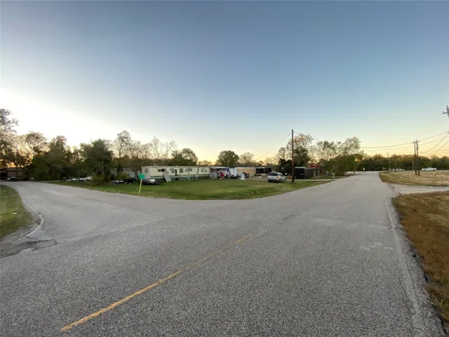 a view of a road with a yard