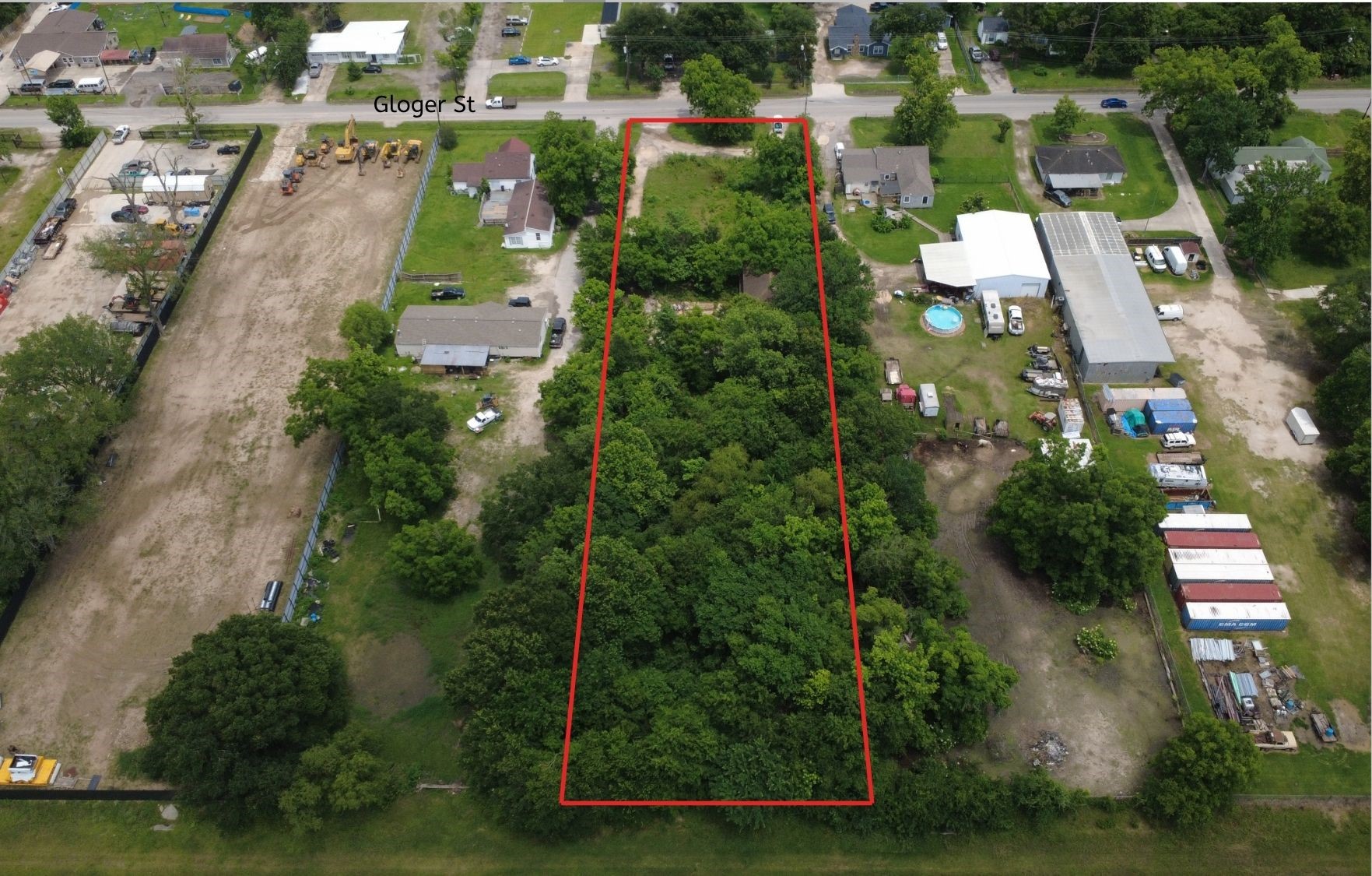 11921 Gloger Street Houston, TX 77039 - Photo 2 of 5 an aerial view of residential houses with outdoor space and trees
