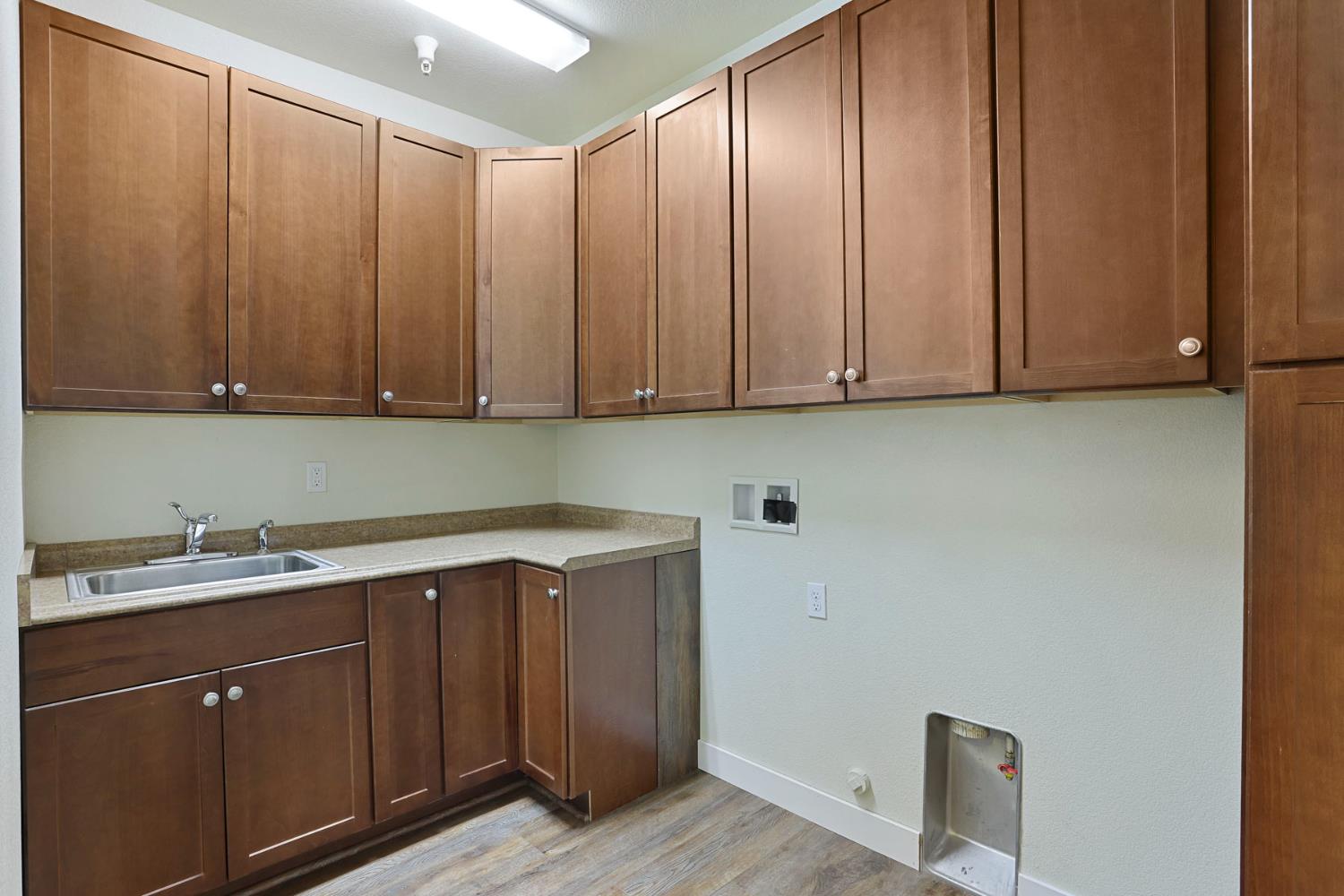 2364 Inyo Place Manteca, CA 95337 - Photo 11 of 69 a view of cabinets with wooden floor