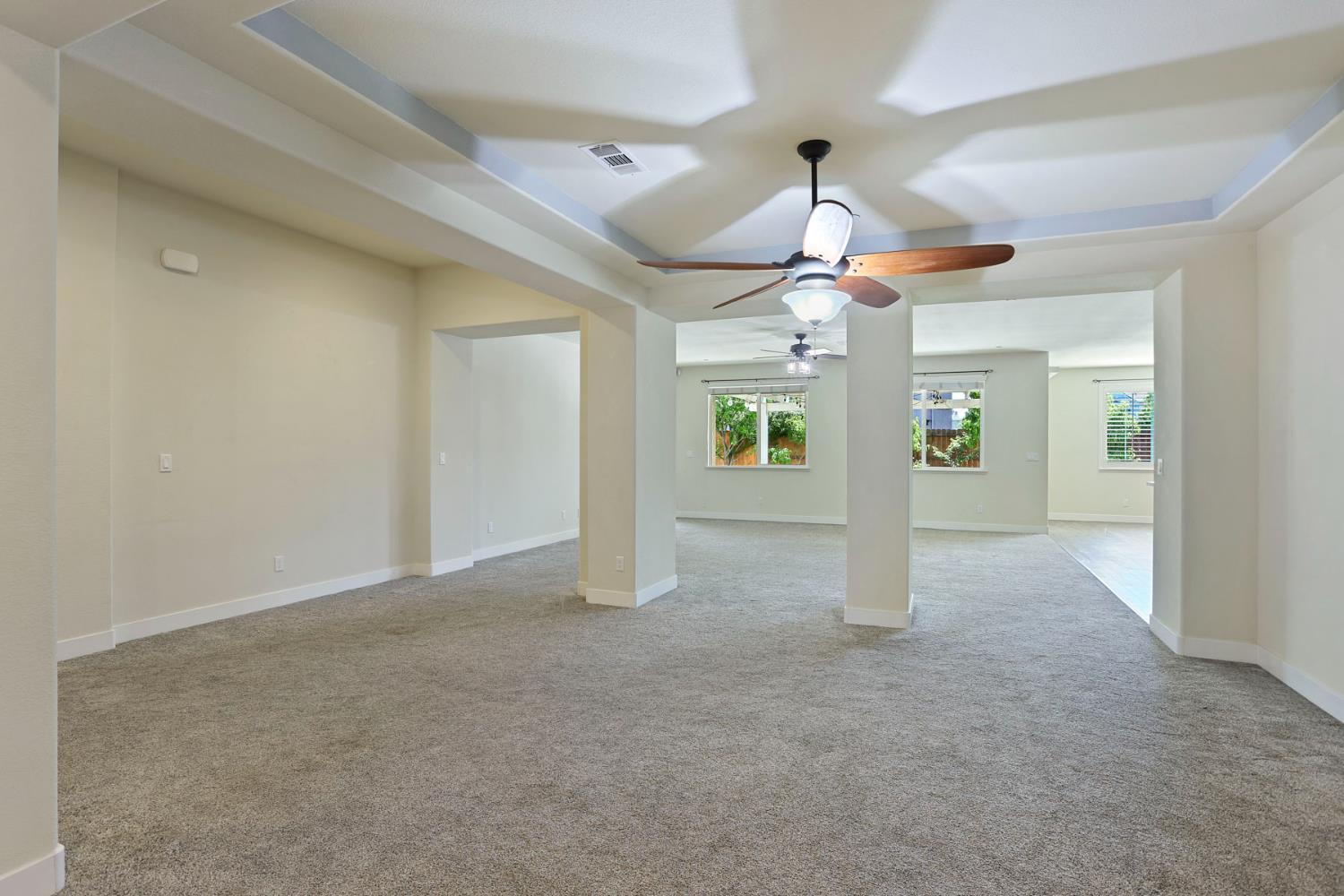 2364 Inyo Place Manteca, CA 95337 - Photo 13 of 69 a view of a livingroom with a ceiling fan and window