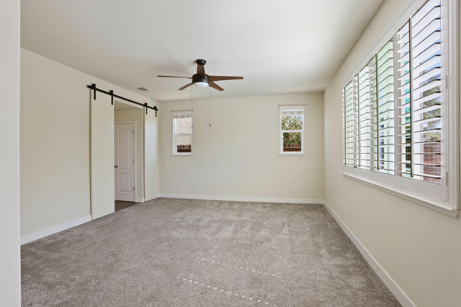 2364 Inyo Place Manteca, CA 95337 - Photo 17 of 69 a view of room with a ceiling fan and window