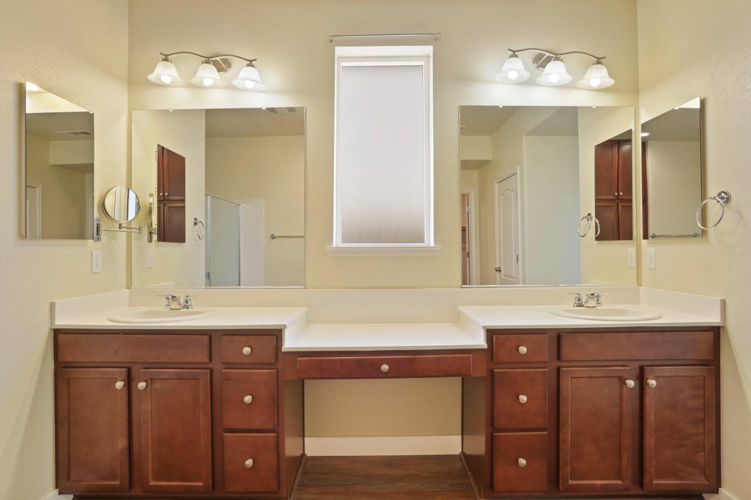 2364 Inyo Place Manteca, CA 95337 - Photo 22 of 69 a bathroom with a double vanity sink and a mirror