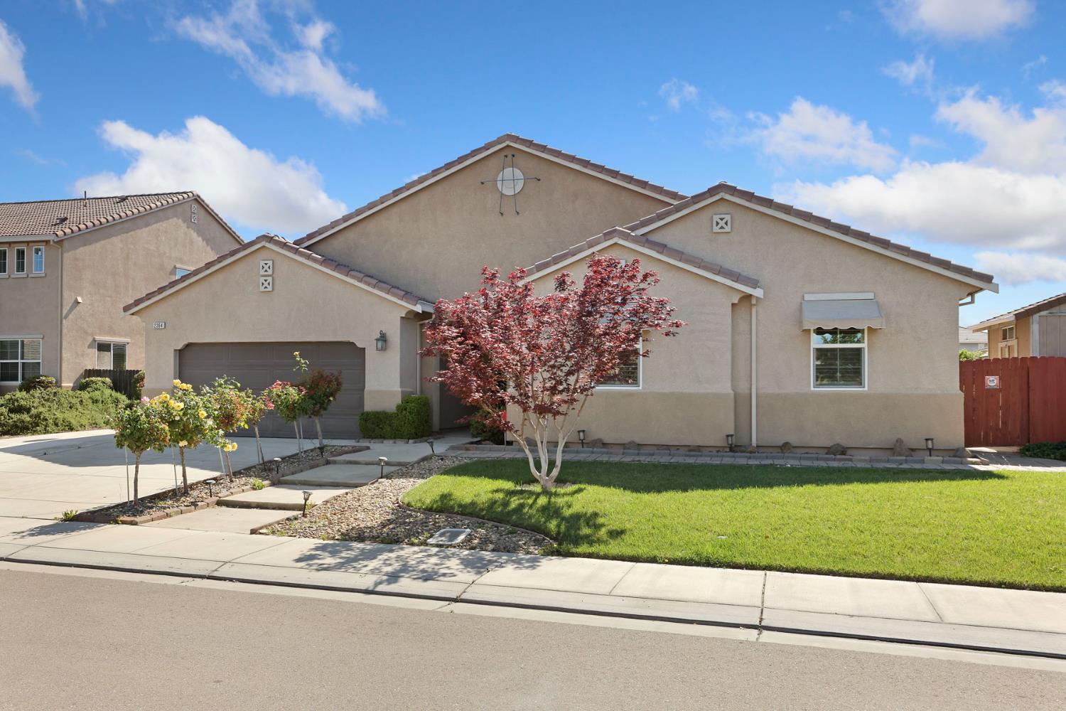 2364 Inyo Place Manteca, CA 95337 - Photo 3 of 69 a front view of a house with a yard and garage