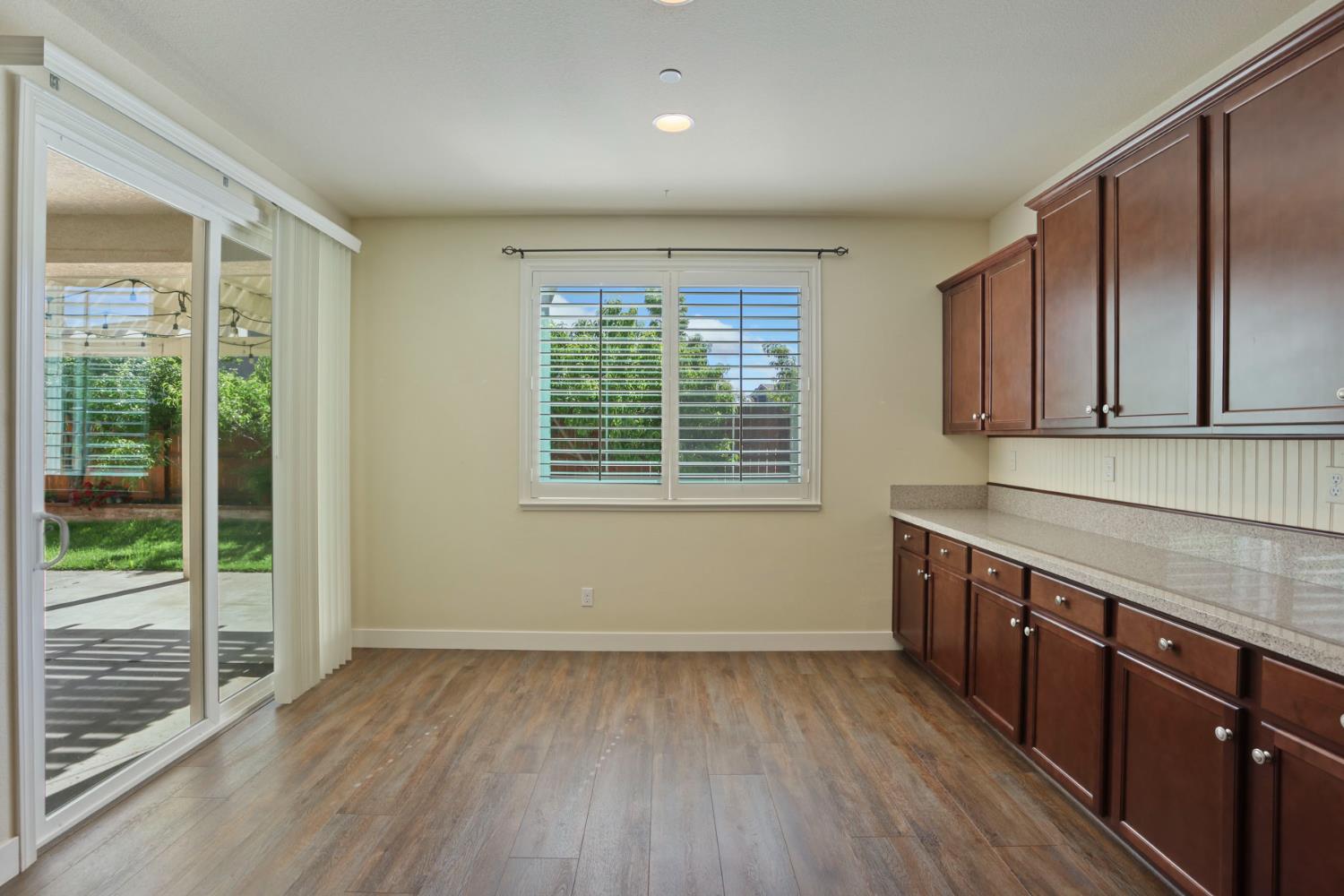 2364 Inyo Place Manteca, CA 95337 - Photo 33 of 69 a view of a kitchen with wooden floor and outdoor space