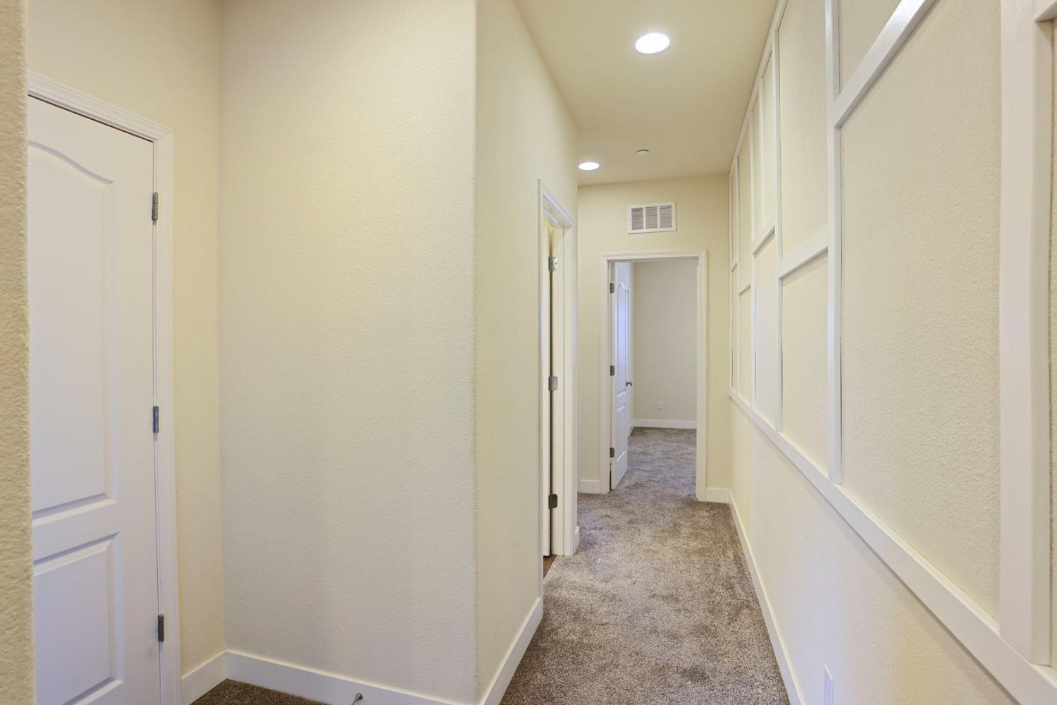 2364 Inyo Place Manteca, CA 95337 - Photo 35 of 69 a view of a hallway with white walls
