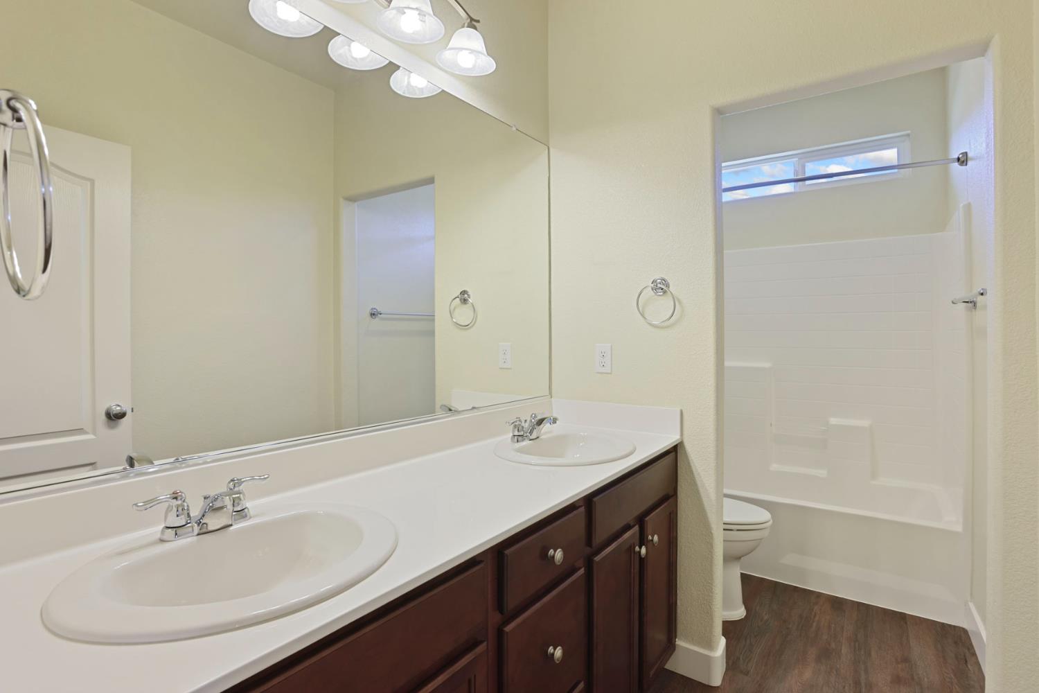 2364 Inyo Place Manteca, CA 95337 - Photo 39 of 69 a bathroom with a sink a toilet and shower