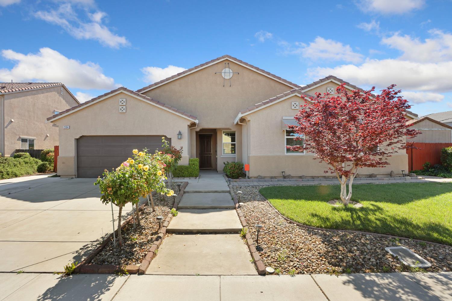 2364 Inyo Place Manteca, CA 95337 - Photo 4 of 69 a front view of a house with a garden