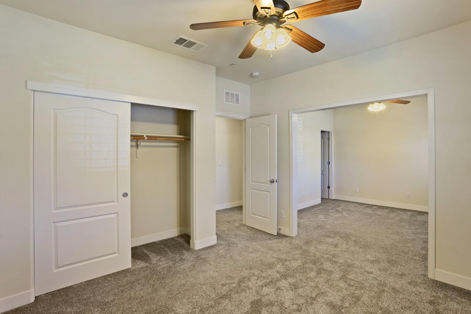 2364 Inyo Place Manteca, CA 95337 - Photo 42 of 69 an empty room with closet and a ceiling fan