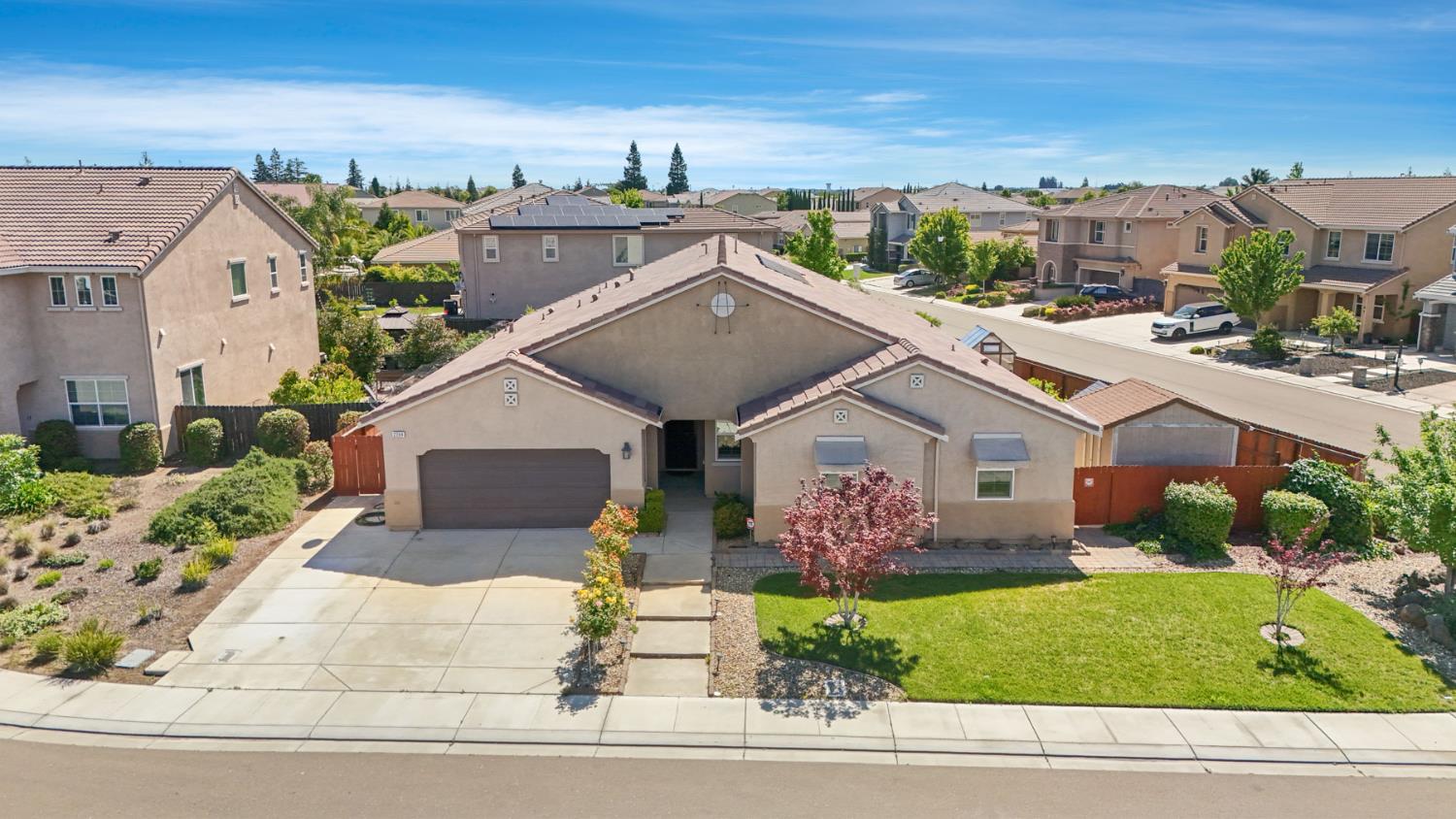 2364 Inyo Place Manteca, CA 95337 - Photo 57 of 69 a front view of a house with a garden