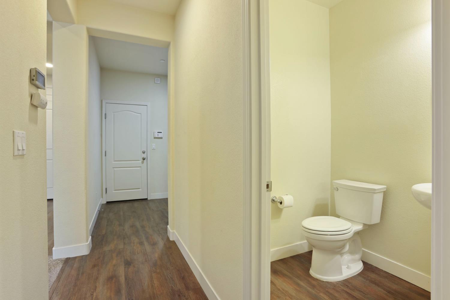 2364 Inyo Place Manteca, CA 95337 - Photo 8 of 69 a bathroom with a toilet and a mirror