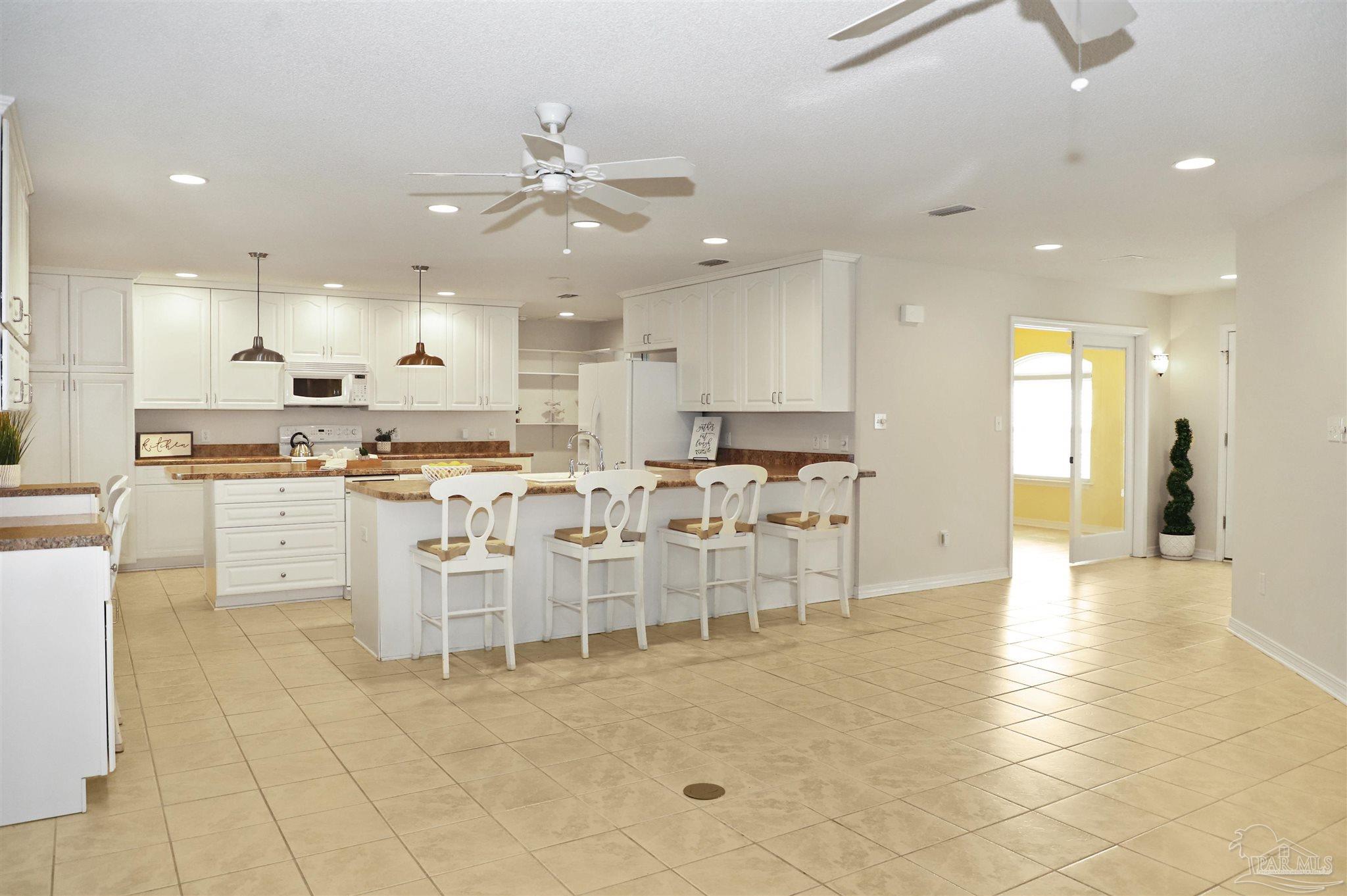 4454 Lyons Place Holt, FL 32564 - Photo 13 of 53 a large kitchen with lots of counter space and appliances