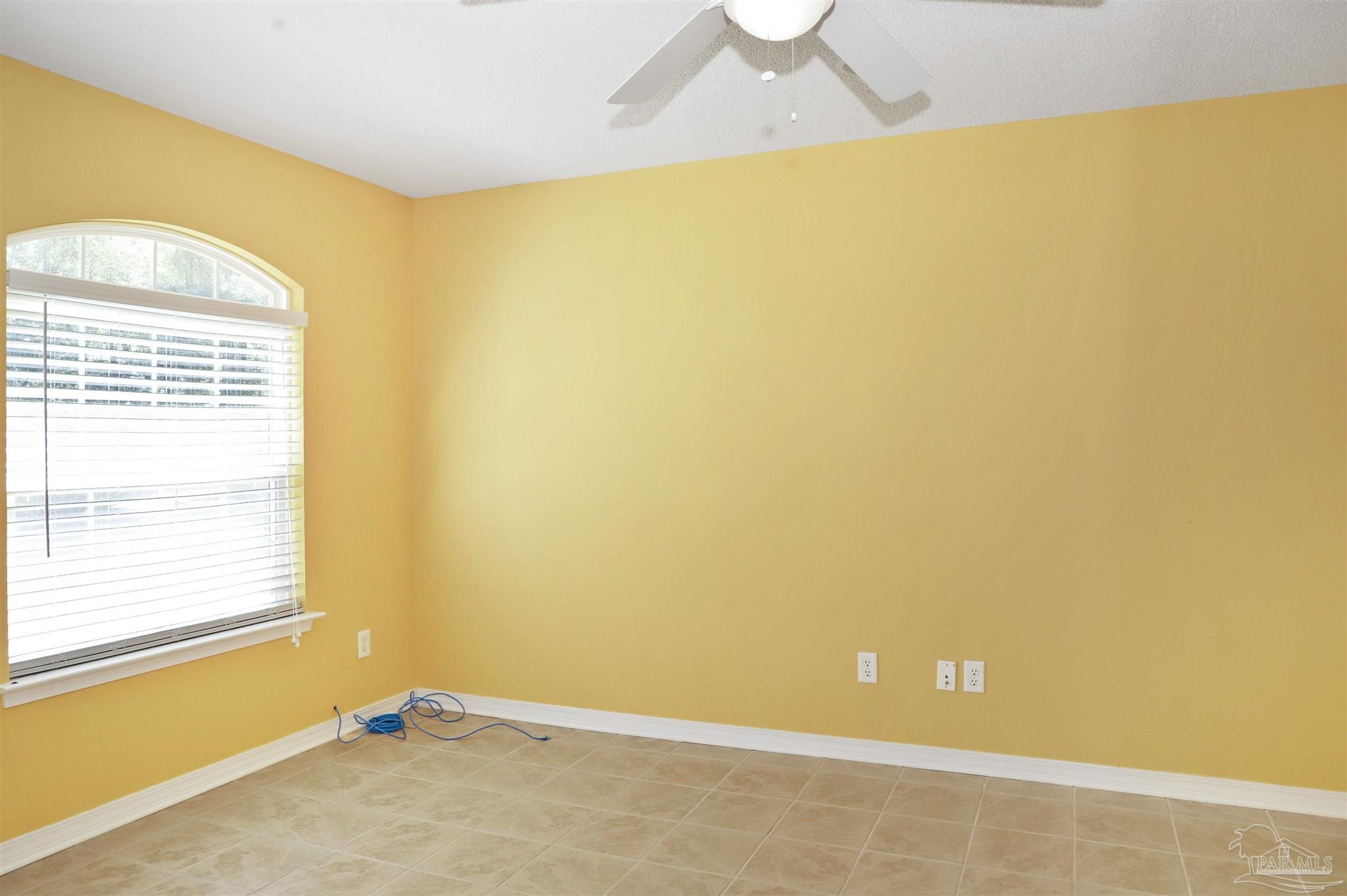 4454 Lyons Place Holt, FL 32564 - Photo 16 of 53 a view of a big room with windows